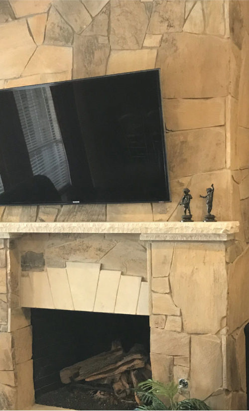 Stone Fireplace With TV Mounted